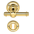 Ordrup door handle in polished brass, with rose and keyhole escutcheon (small model)