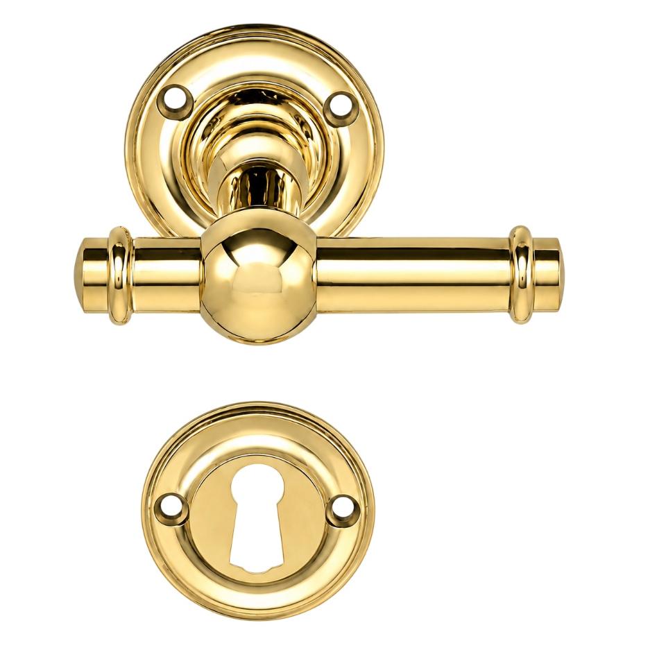 Ordrup door handle in polished brass, with rose and keyhole escutcheon (small model)