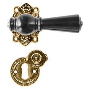 Østerbro black wood door handle with rose and covered keyhole escutcheon in lacquered polished brass