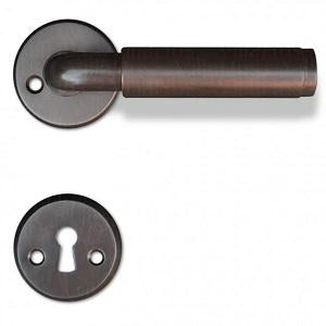 Funkis Espergærde door handle in burnished brass, with rose and keyhole escutcheon
