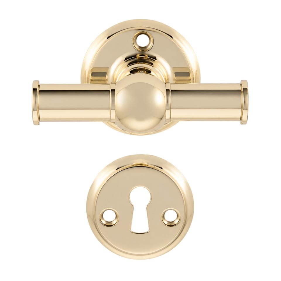 Rungsted cross-style door handle in polished brass, with rose and keyhole escutcheon