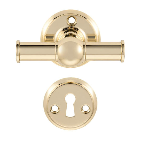 Rungsted cross-style door handle in polished brass, with rose and keyhole escutcheon