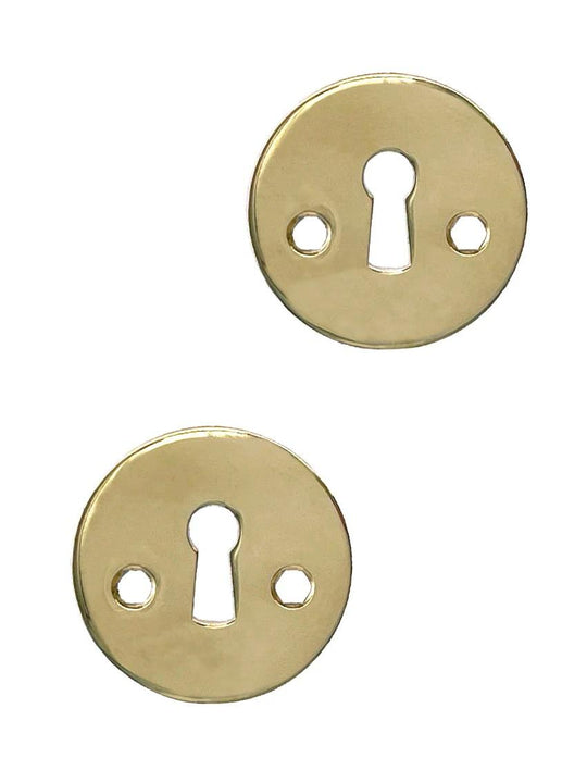 Rex keyhole escutcheons, unlacquered polished brass • KYNER & Co
