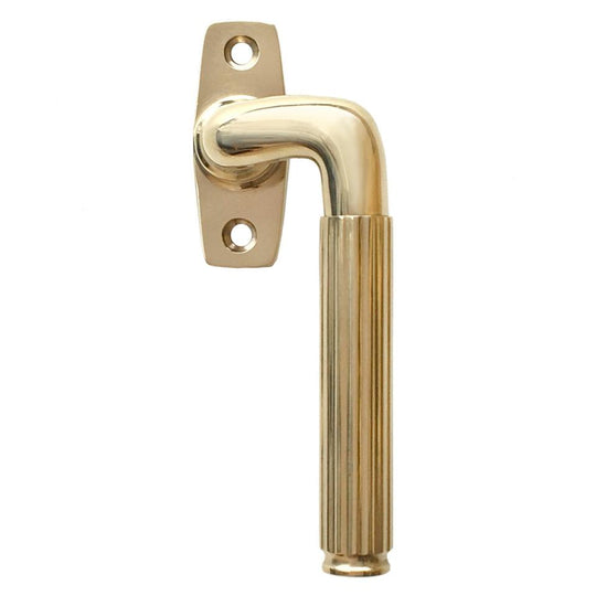 Rex window handle, unlacquered polished brass • KYNER & Co