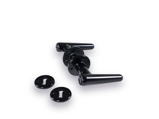 Torpedo black Bakelite door handles with roses and keyhole escutcheons for older doors