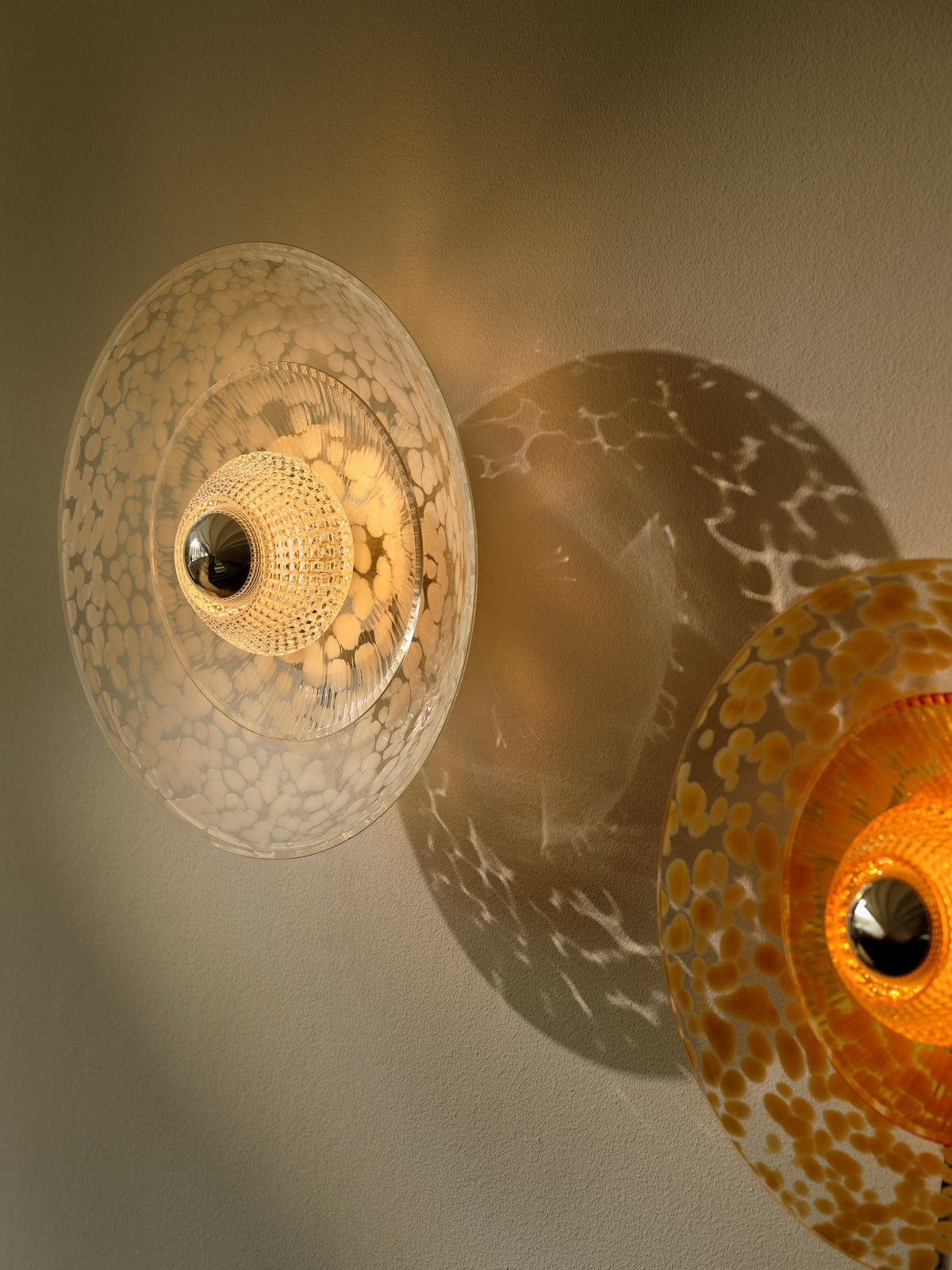 Disco Rama wall light, amber • Design by Us